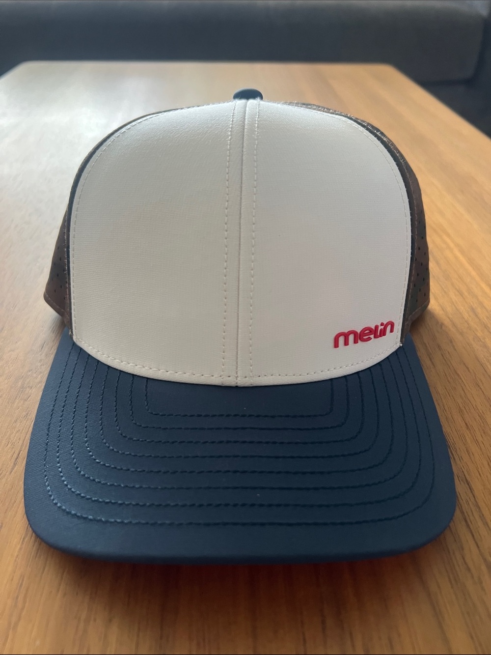 Melin Trucker Hat White Front Navy Brim Brown Mesh with Red Logo